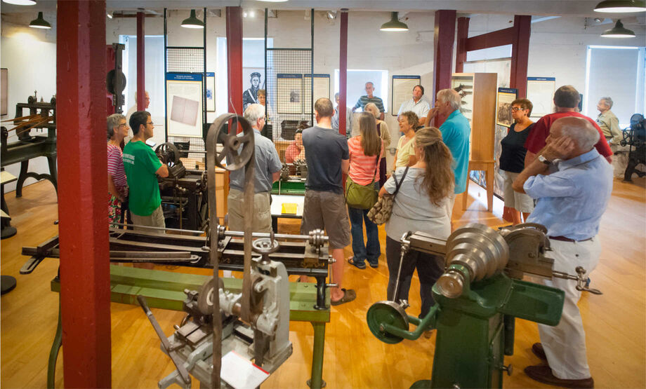 Visitors to the American Precision Museum participate in a gallery talk. NEH funding helped the museum create an interactive permanent exhibition, *Shaping America*, that traces the history of the machine tool industry. Image courtesy of First Light Studios.