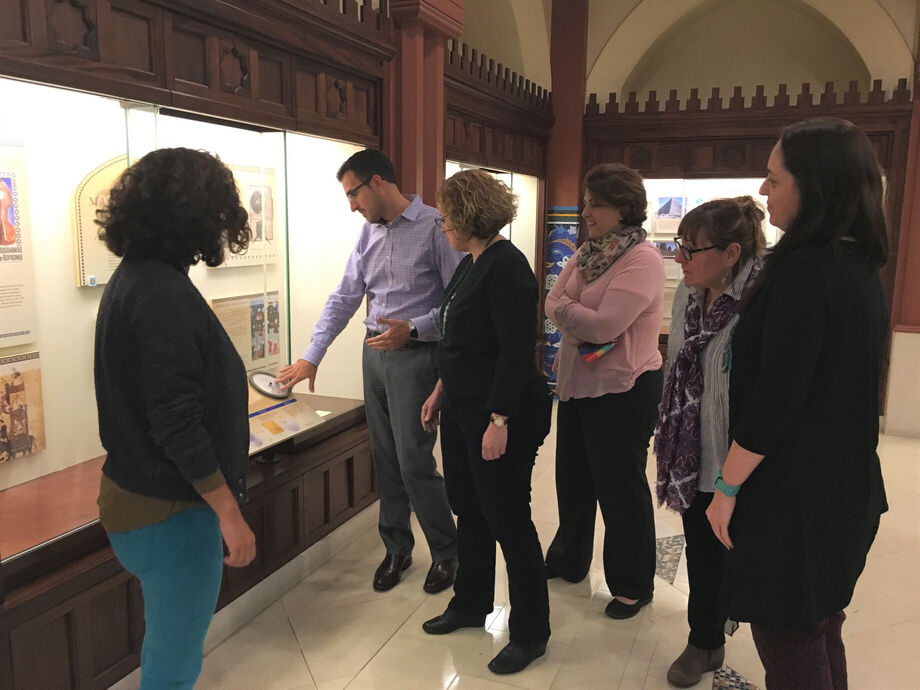 Scholars examine an exhibit at the Arab American National Museum. Image courtesy Arab American National Museum.