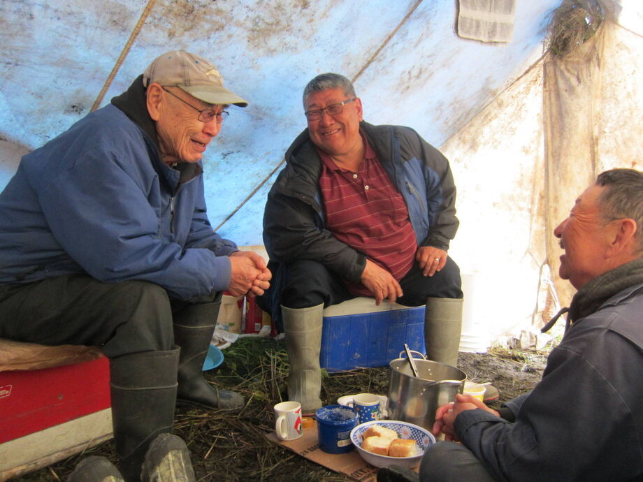 Calista Education and Culture director Mark John converses with Lawrence Edmund and Denis Sheldon on the lower Yukon River during a trip associated with the Yup'ik Historical Narratives project. Image courtesy of Ann Riordan.