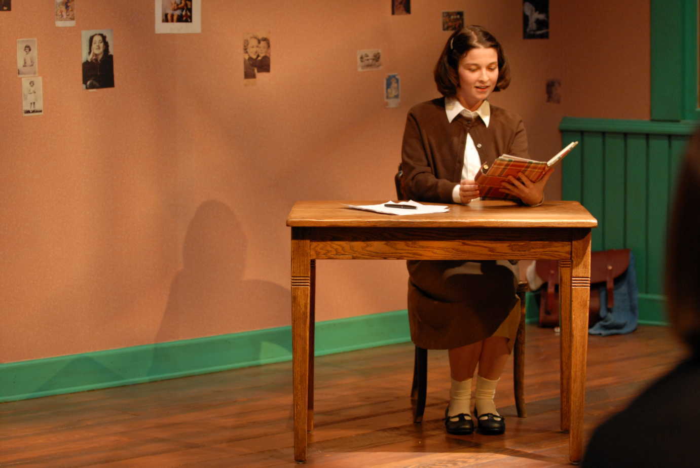 *The Power of Children* is an immersive experience that includes theater production in the exhibits. Here, Anne Frank reads from her diary.  Image courtesy of the Children's Museum of Indianapolis.