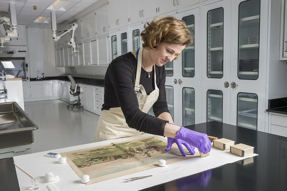 Joanna Didik, conservator, works in the paper conservation lab at the Helmerich Center for American Research at the Gilcrease Museum.  Image courtesy of the Gilcrease Museum.