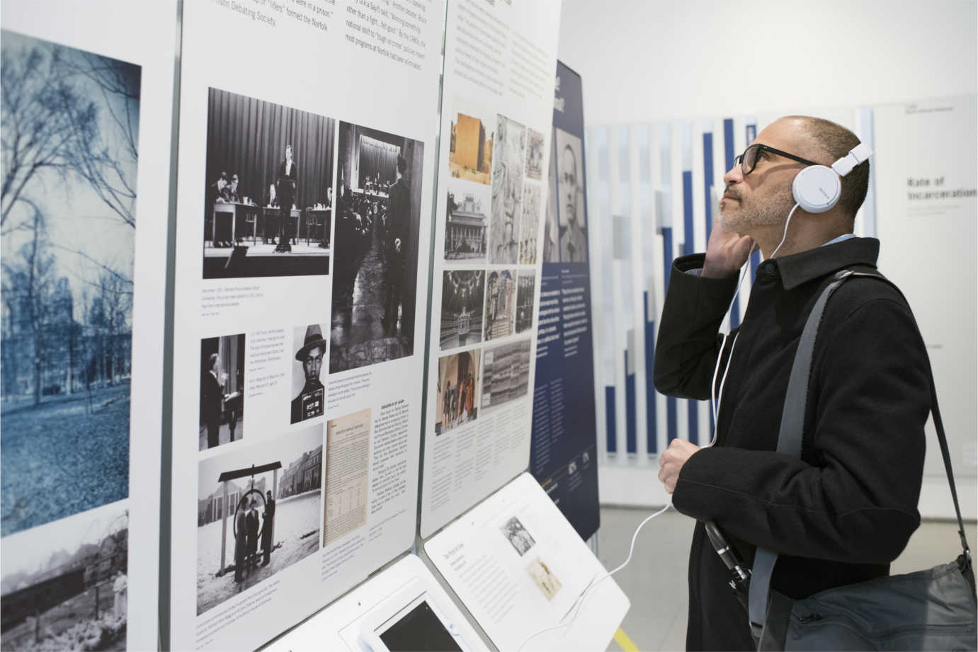 A visitor listens to an audio component of *States of Incarceration.* Image courtesy of the Humanities Action Lab.