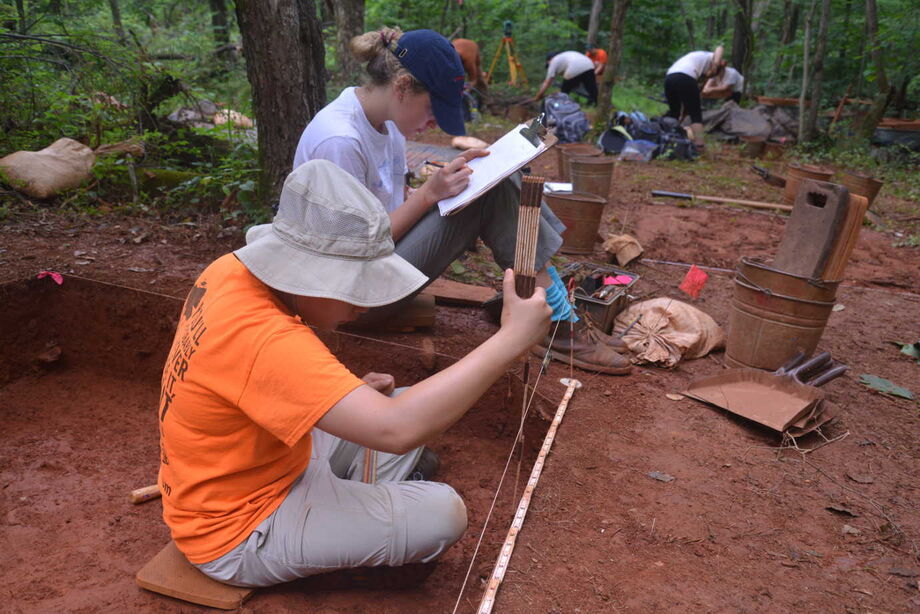 Students in the Monticello-University of Virginia Archaeological Field School record a profile of a five-foot excavation quadrat at Site 6, a domestic site occupied in the first quarter of the 19th century by enslaved agricultural laborers. Image courtesy of Monticello.