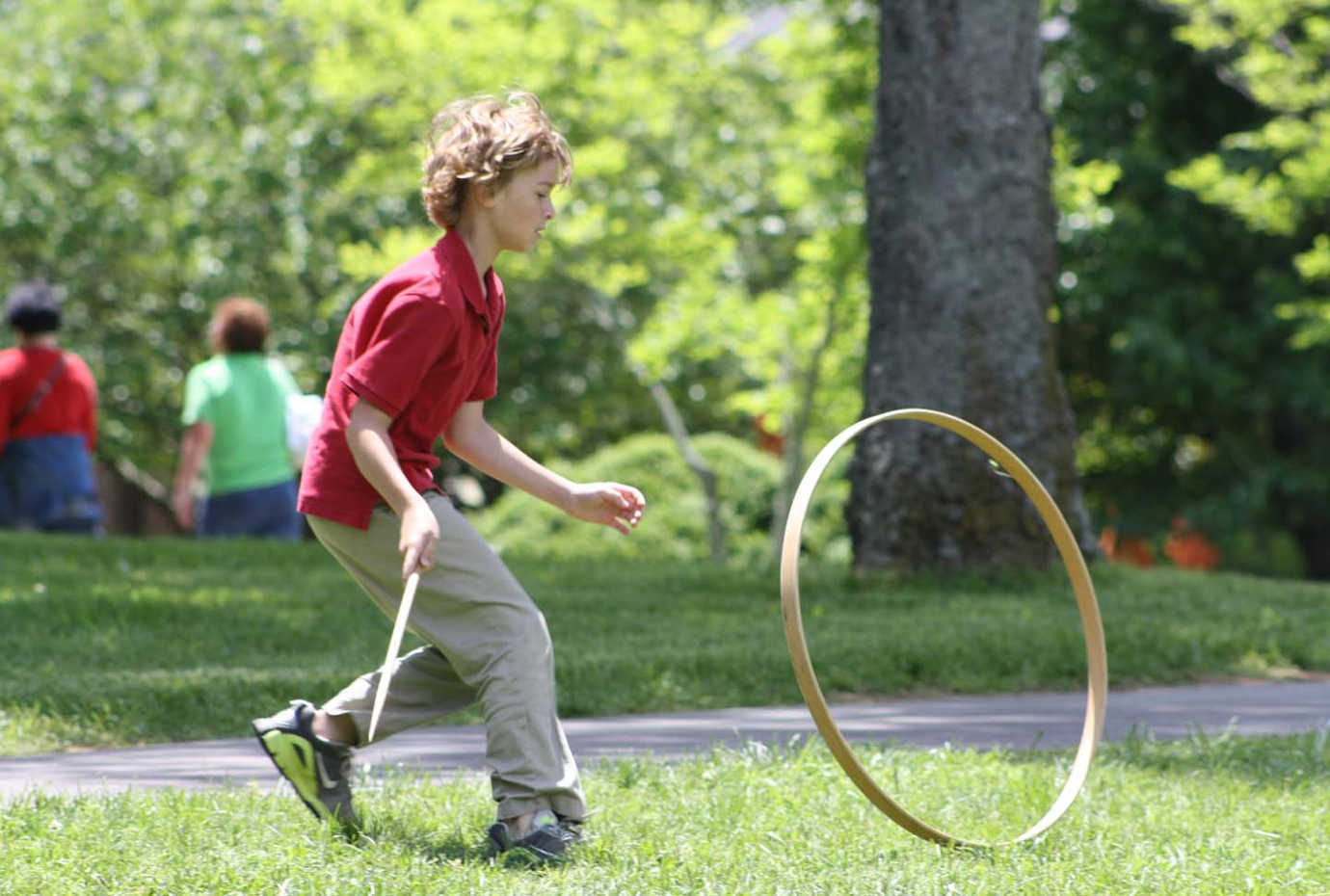 A visitor plays with a hoop, a common nineteenth-century children's game, on the grounds at Andrew Jackson's Hermitage. Image courtesy of The Hermitage.