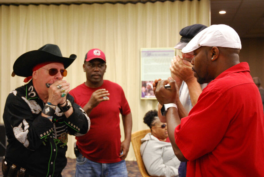 Attendees at the 2018 South Carolina State Fair were able to participate in a harmonica workshop with Freddie Vanderford, winner of the South Carolina Jean Laney Harris Folk Heritage Award. This and other traditional arts programs have been featured at the fair through FOLKFabulous—a program of the McKissick Museum at the University of South Carolina funded through an NEH grant. Image courtesy of the McKissick Musem.