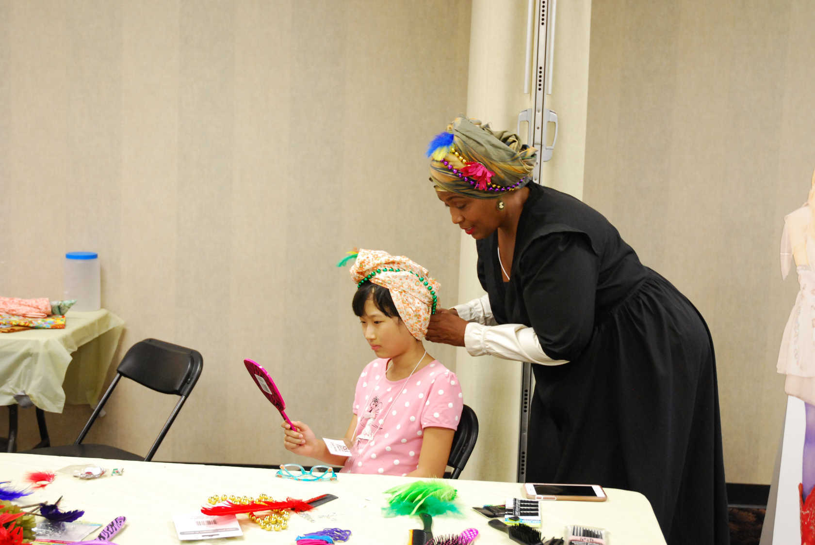 As part of the 2017 FolkFabulous program, New Orleans-based artist Karen Livers offered educational workshops on headwrapping. Image courtesy of the McKissick Museum.