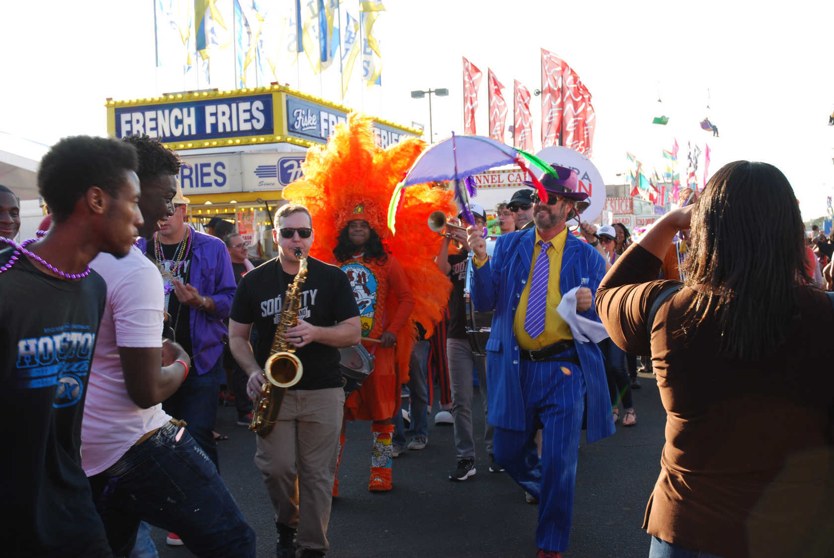 Mark Rapp of ColaJazz leads a second line procession around the South Carolina fairgrounds. Image courtesy of the McKissick Museum.