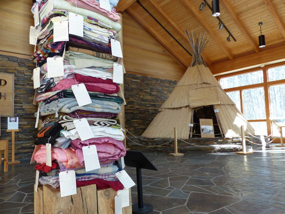 The iconic tule reed tipi welcomes visitors to the *By Hand Through Memory* exhibition exploring the living cultures of Plateau Native Americans. The High Desert Museum recently acquired tribal artist Marie Watt’s Blanket Stories, to emphasize the dynamic contemporary art scene that builds on the native traditions. Image courtesy of the High Desert Museum.