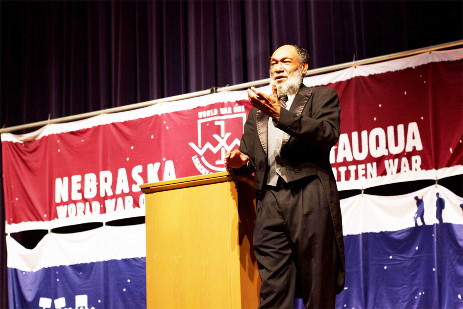 Chautauqua scholars, dressed as historic figures, help audiences engage with the past. Here, W.E.B. DuBois takes the stage. Image courtesy of Humanities Nebraska.