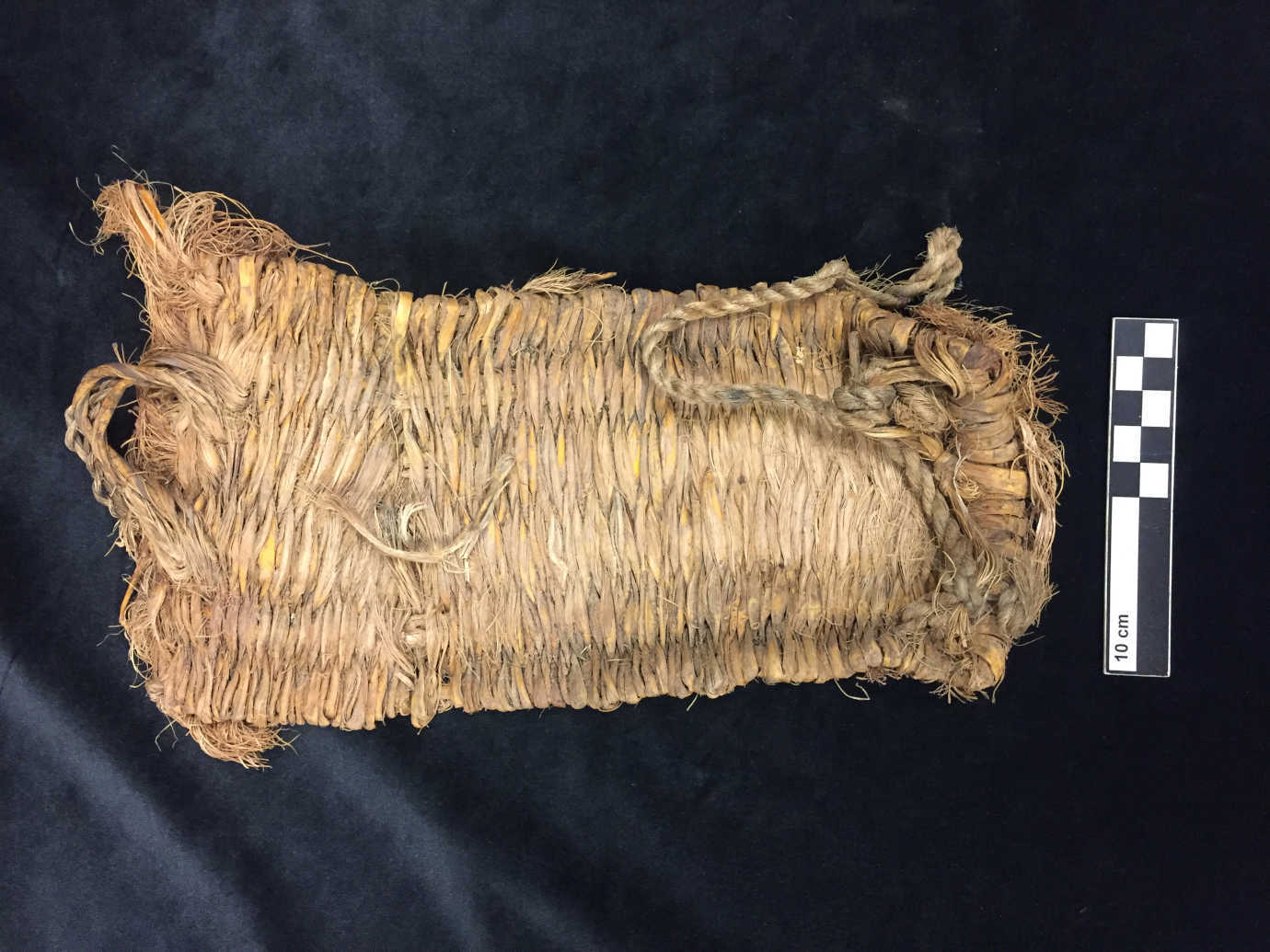 Plain weave sandal from an alcove site on Comb Ridge, west of Blanding, Utah. The sandal likely dates to the Basketmaker II period, and may be about 2000 years old. Courtesy of Bureau of Land Management, Utah and Edge of the Cedars State Park Museum.