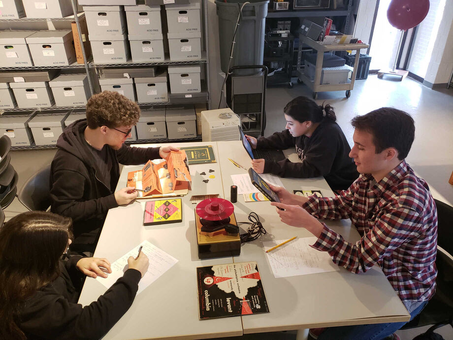 NEH funding has helped the Sarnoff Collection preserve its collection of audiovisual objects. Here, students explore items from the collection during a class visit. Image courtesy of the Sarnoff Collection.