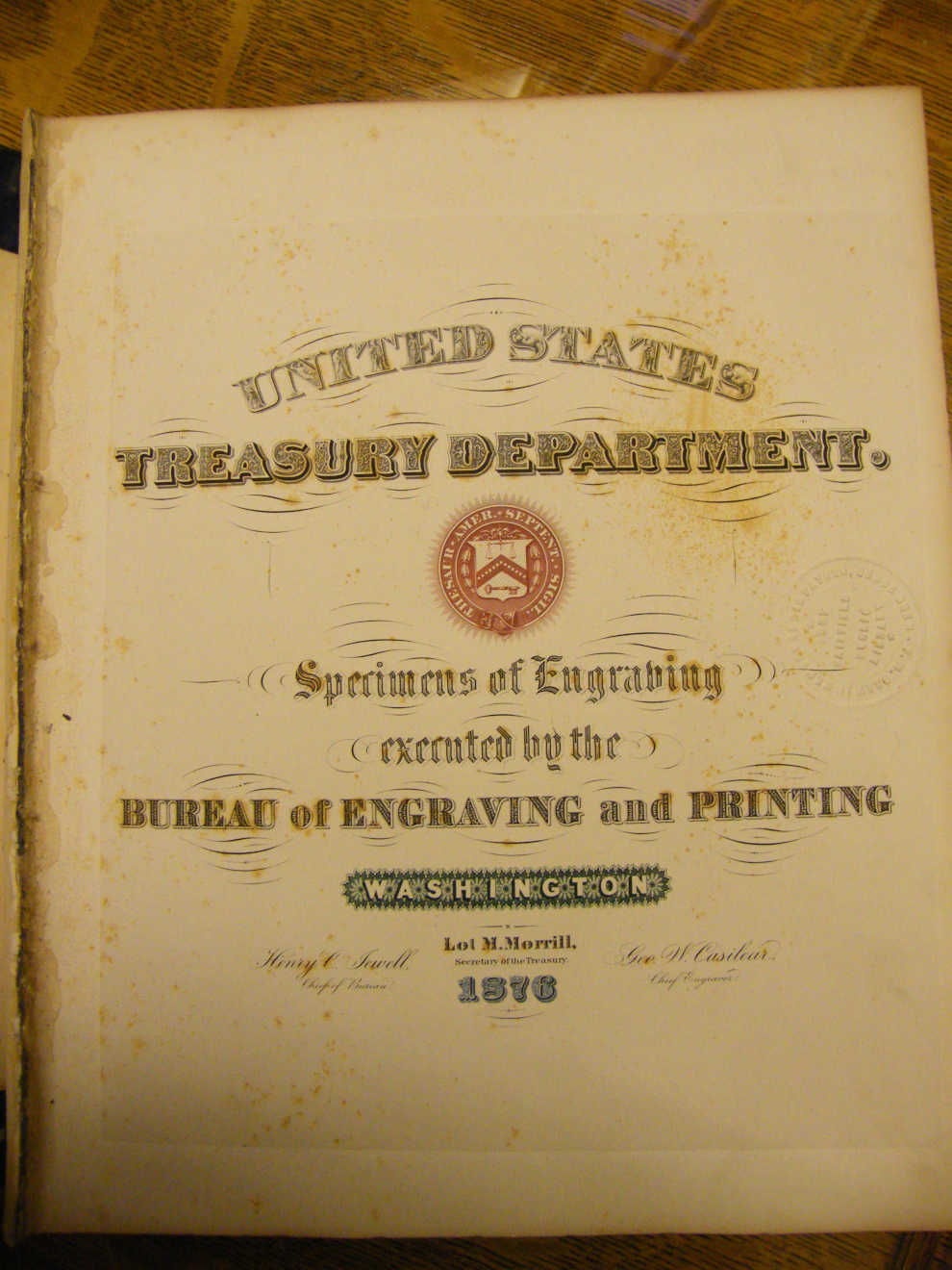 Title page of goldleaf, embossed Specimens of Engraving Book given to Colonel Franklin Drew by Lot Morrill, the 31st Secretary of the Treasury under Ulysses S Grant and the 28th Governor of Maine. Photo courtesy of Fort Fairfield Public Library.