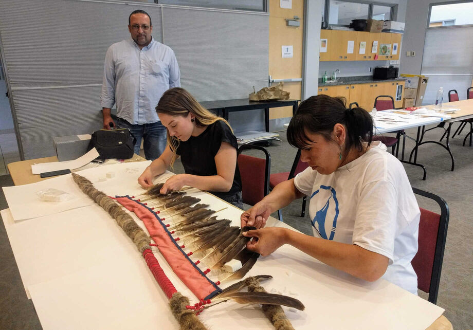 Conservators from the Midwest Art Conservation Center offer workshops like “Conserving and Cleaning Feathers: A Hands-On Introduction,” ensuring that collections of indigenous artifacts are properly conserved. Image courtesy of the Midwest Art Conservation Center.