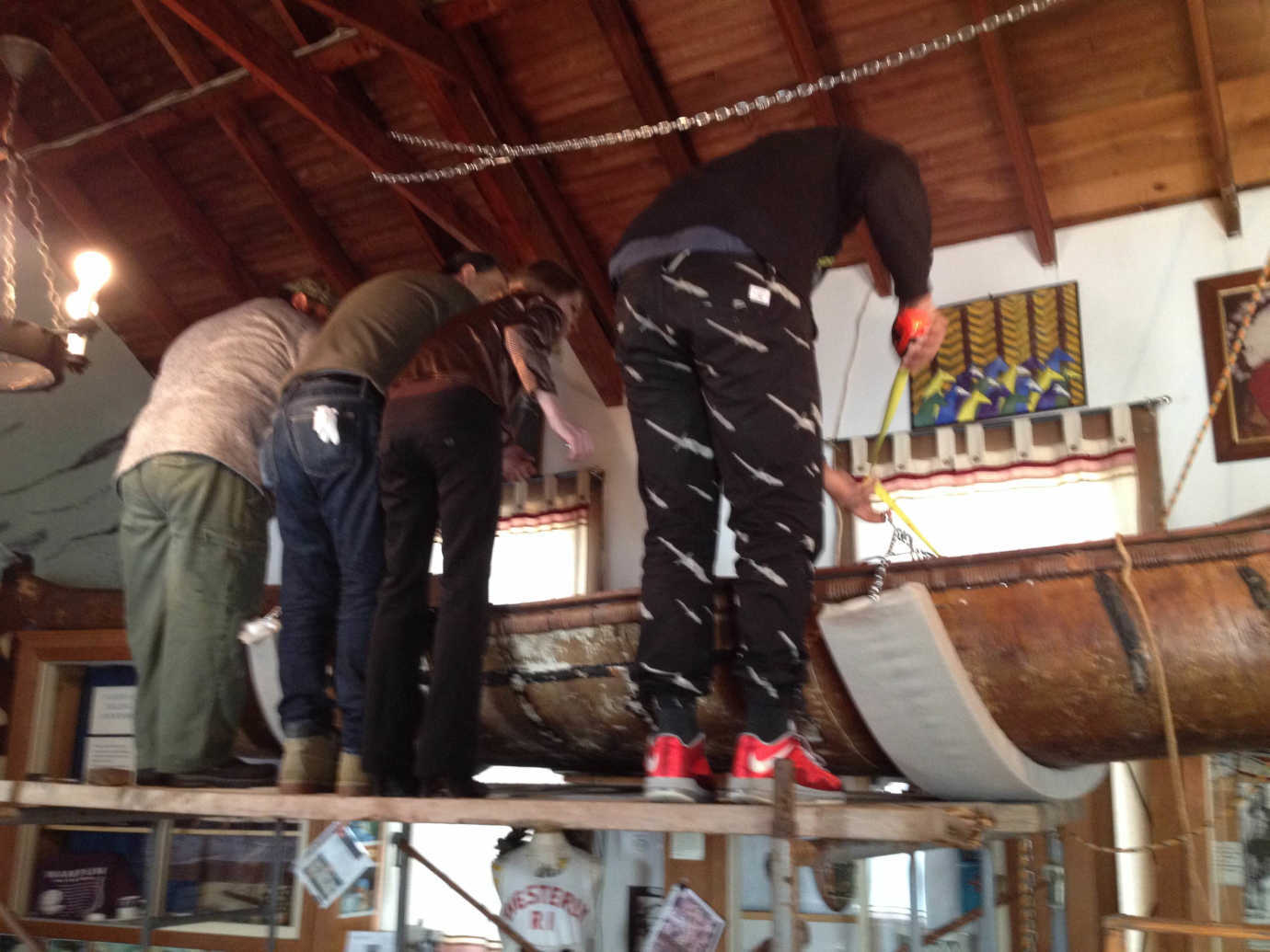 Restoring a canoe from Tomaquag's collections. Photo courtesy of Tomaquag Museum.