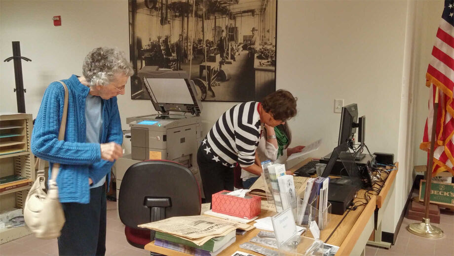Franco-American Collection volunteers scan archival materials belonging to veterans and their families. The NEH-funded initiative helped the archive digitize more than 420 items, preserving them for future generations. Image courtesy of the Franco-American Collection.