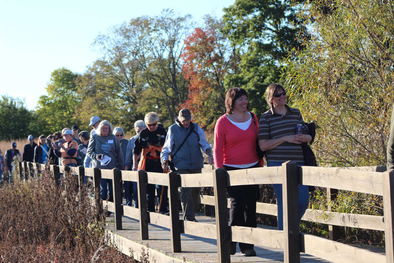 Walking and talking at the restored Loblolly Marshes made famous by Gene Stratton Porter, a Hoosier native who wrote some of the first widely popular environmental literature in the early 20th century. Photo courtesy of Tessa Tillet for Indiana Humanities.