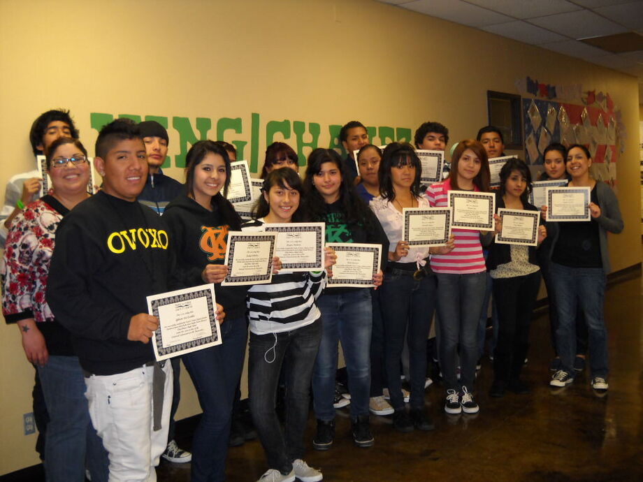 A Story Talk group in a San Diego high school receives certificates acknowledging their completion of the program. Image courtesy of People & Stories/Gente Y Cuentos.