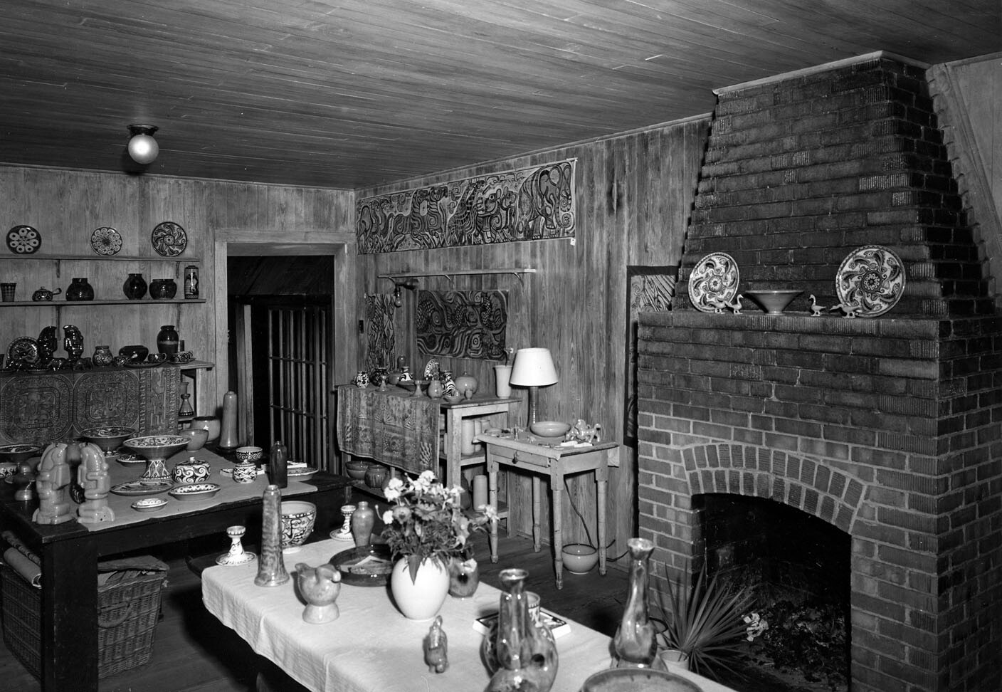 The display room at Shearwater Pottery, Ocean Springs, MS, offered a variety of shapes and designs, all of them the original creations of nationally-acclaimed brothers Peter and Walter Anderson.  On August 29, 2005, Hurricane Katrina virtually destroyed Shearwater Pottery on its bluff overlooking the Ocean Springs small craft harbor.  Photo from Mississippi Gulf Coast Community College C.C. &ldquo;Tex&rdquo; Hamill Down South Magazine Collection, circa 1956.
