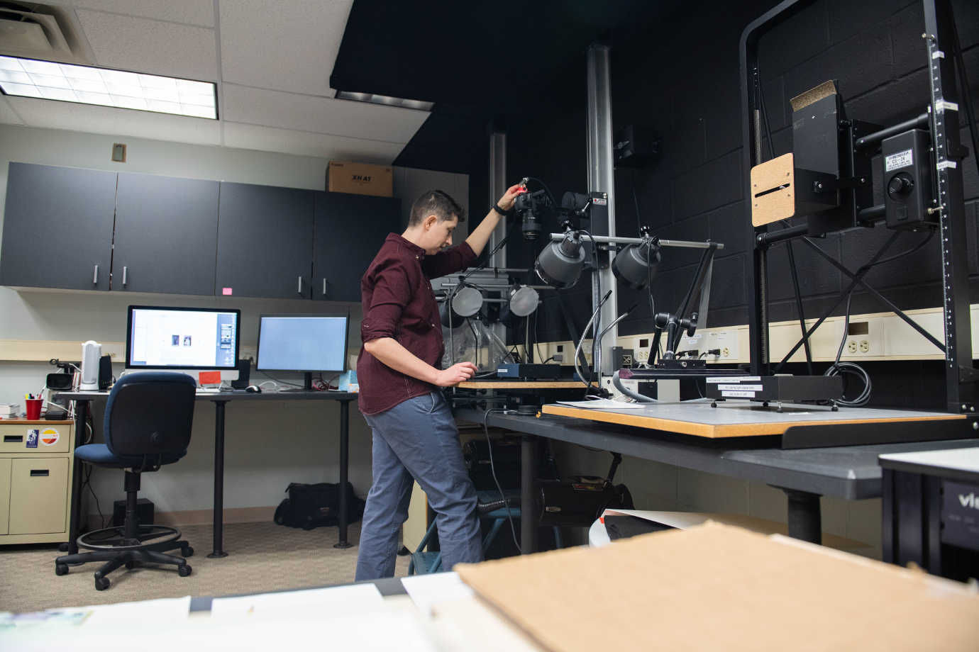 Al Carver-Kubik, Research Scientist, photographs an object for Graphics Atlas. Image courtesy of the Image Permanence Institute.