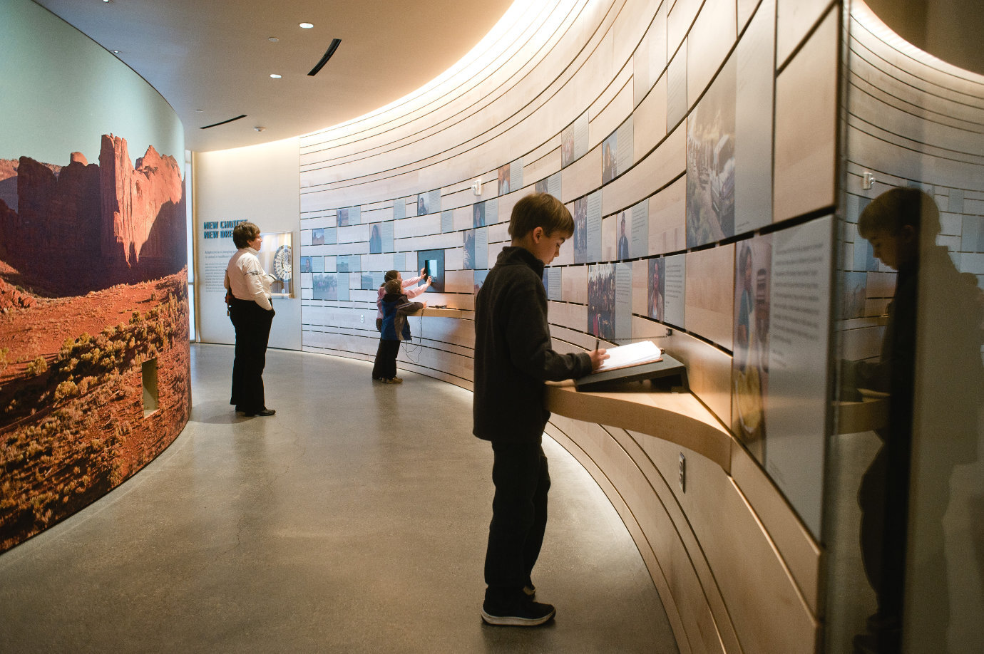 Children engage with interactive components of the *Native Voices* exhibition. Image courtesy of the Natural History Museum of Utah.