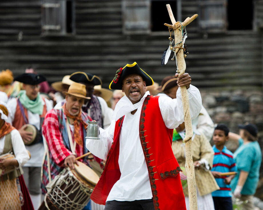 At Historic Hudson Valley, a music and dance group leads a crowd in celebration of Pinkser, a holiday celebrated by African and Dutch communities in eighteenth-century New York. Image courtesy of Historic Hudson Valley.