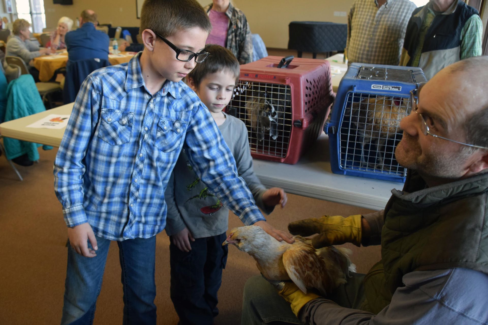 Families attending the community dinner exploring “Our Heritage of Chickens” learned about raising hens from a local farmer. Photo courtesy Entrada Institute, Inc.