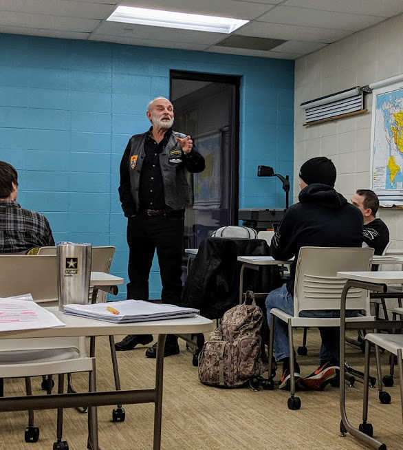 DePaul University Professor and Vietnam War veteran James Brask speaks at a public Veterans Day event about both “The Value of the Veteran Voice” and the importance of a civilian audience to hear and respond. Photo courtesy of Mark Waters.