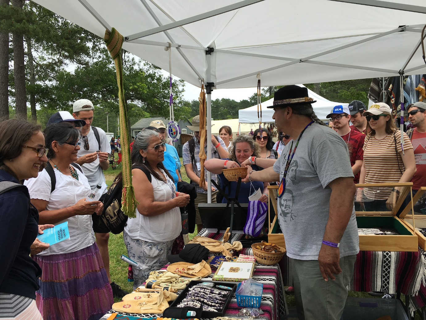 Unkachaug Chief Harry Wallace greets K-12 educators at Mashpee Powwow. Image courtesy of University of Massachusetts, Amherst