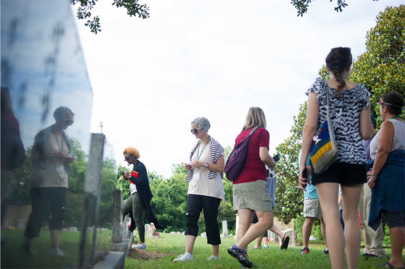 Teachers explore the Chinese Cemetery in Greenville, Mississippi. The historic burying ground for the town's Chinese American community is located across the street from Live Oak Cemetery. Image courtesy of the Delta Center for Culture and Learning at Delta State University.