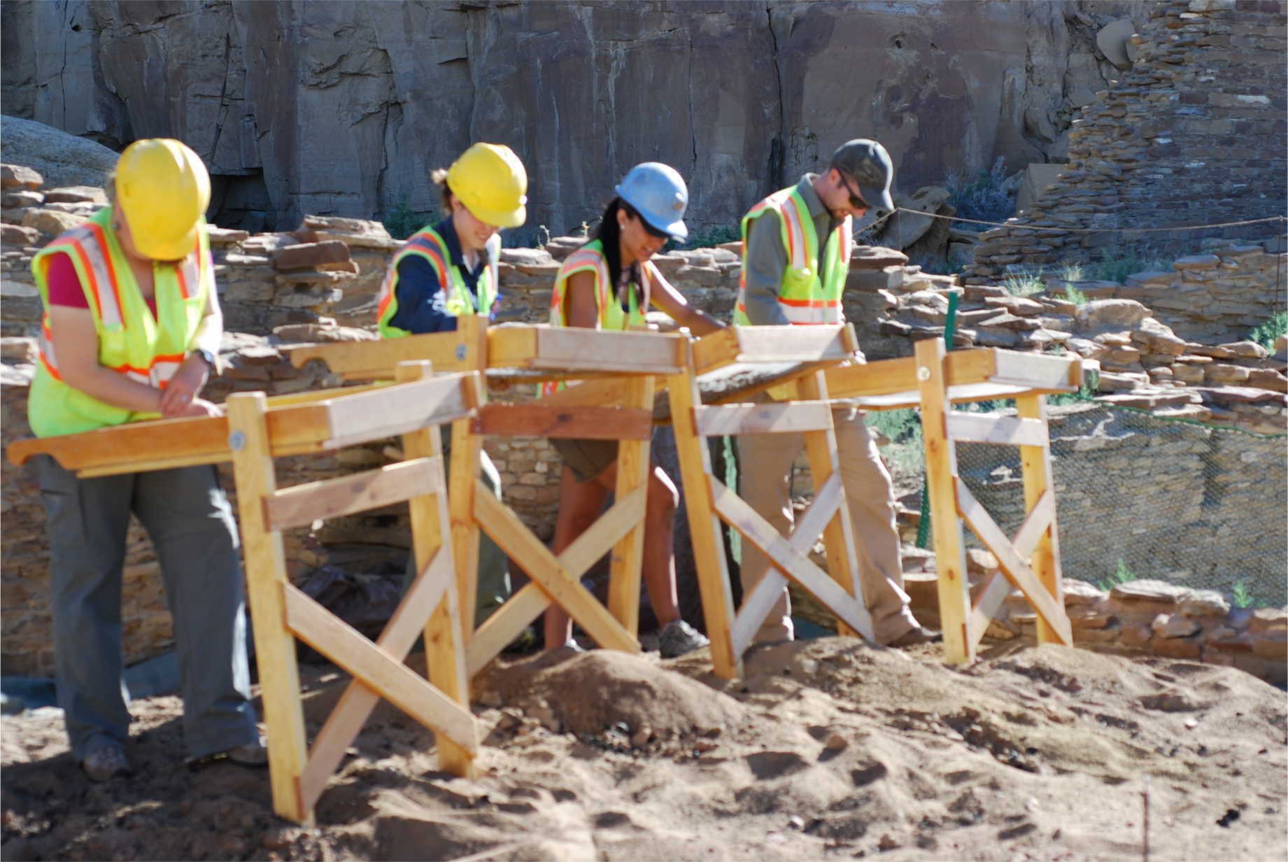 Student crew screening dirt excavated from Room 28 at Pueblo Bonito, June, 2013.  Photograph by Patricia Crown.