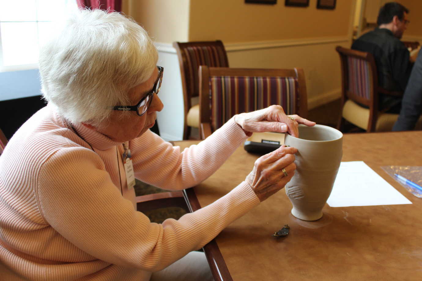 Project Unpack brought art workshops to assisted living centers. There, veterans and their families used personal mementos to make works of art while reflecting on their experiences. Image courtesy of Project Unpack.